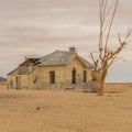 The abandoned Garub Railway Station with a daed tree near Kolmanskop Royalty Free Stock Photo