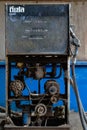 Abandoned gas pump with bare mechanism and nozzle