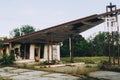 Abandoned Gas Station with Broken Windows