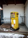 Abandoned gas station with yellow pump Royalty Free Stock Photo