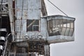 abandoned giant bucket wheel excavator stands in a field in winter