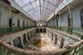 Abandoned girls high school, lycee V in Belgium. Fish-eye shot of the large hall.