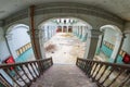 Abandoned girls high school, lycee V in Belgium. Fish-eye shot from the stairs down into the hall.