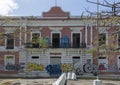 Abandoned government building disgraced by graffiti.