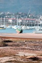 Abandoned green boat in the port of Hendaye France at low tide Royalty Free Stock Photo