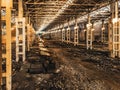 Abandoned and haunted industrial creepy warehouse inside, old ruined grunge factory building Royalty Free Stock Photo