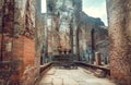 Abandoned historical statue of standing Buddha without head. UNESCO world heritage site of Polonnaruwa, Sri Lanka