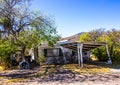 Abandoned Home With Blocked Out Windows & Collapsing Carport