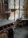 Ramshackle kitchen space in ruins of old building