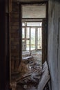 an abandoned hotel room after a raid by vandals