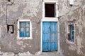 Abandoned house with blue door and windows Royalty Free Stock Photo