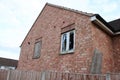 Abandoned house with a boarded up window and a smashed window UK Royalty Free Stock Photo