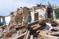 An abandoned house collapses. The house is destroyed. Cracks in wall of house. Destruction of old houses