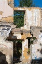 An abandoned house collapses. The house is destroyed. Cracks in wall of house. Destruction of old houses, earthquakes