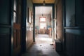 abandoned house hallway with doors ajar leading to darkness Royalty Free Stock Photo