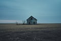 an abandoned house in the middle of a field Royalty Free Stock Photo