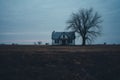 an abandoned house in the middle of a field Royalty Free Stock Photo