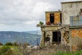 Abandoned house on a mountains background in unpopulated village in Cyprus