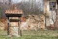 Abandoned house and an old draw well near it Royalty Free Stock Photo