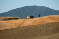 abandoned house on rolling hills under the blue sky Royalty Free Stock Photo