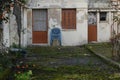 Abandoned house with rotting fruit on grassed yard Royalty Free Stock Photo