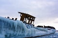 Abandoned iced barge on the shore of frozen lake Royalty Free Stock Photo