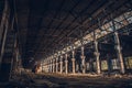 Abandoned industrial creepy warehouse inside old dark grunge factory building Royalty Free Stock Photo