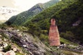 Abandoned industrial furnace against the backdrop of mountain pe