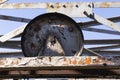 Abandoned industrial metal rusted wheel for cableway mining Royalty Free Stock Photo