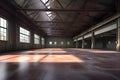 Abandoned industrial warehouse interior with large windows and wooden floor Royalty Free Stock Photo