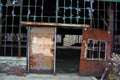 Abandoned Industrial Warehouse with Rusty Door in Urban Decay Royalty Free Stock Photo