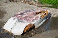 Abandoned inverted boat lying on the shore of the damaged hull Royalty Free Stock Photo