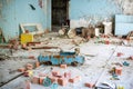 Abandoned kindergarten in Chernobyl Exclusion Zone. Lost toys, A broken doll. Atmosphere of fear and loneliness. Ukraine, ghost