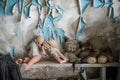 Abandoned kindergarten in Chernobyl Exclusion Zone. Lost toys, A broken doll. Atmosphere of fear and loneliness. Ukraine, ghost