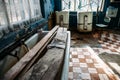 Abandoned laundry building, old washing machines, rusty baths