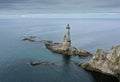 Abandoned Lighthouse Aniva on the Rock in Sakhalin Island, Russia. Royalty Free Stock Photo