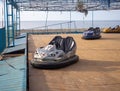 Abandoned Luna Park. Autodrom. Cars are covered with tarpaulins. Old carousels. Does not work. Broken attraction. resort in