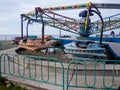 Abandoned Luna Park. A crisis. Old carousels. Does not work. Broken attraction. resort in winter. Broken business. Not working