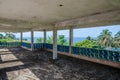 Abandoned luxury lodge with terrasse overlooking ocean, traces of civil war, Robertsport, Liberia, West Africa