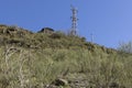 Abandoned metal tower structure in mountain landscape of Asturias Spain on a bright day