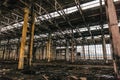 Abandoned metallurgical excavator plant or factory interior, industrial warehouse building waiting for a demolition Royalty Free Stock Photo