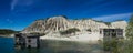 Abandoned mines and hauses. Quarry and old prison architecture. Crystal clear blue water, lake and mountain. The ashes dunes