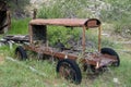Abandoned mining vehicle cart in an overgrown field in Bayhorse Ghost Town in Idaho