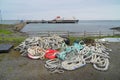 Abandoned mooring ropes at ferry terminal