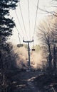 Empty Mountain Chairlift in the forest with wood chairs