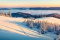 Abandoned mountain village in high mountains. Bright winter scene of Carpathians. Misty sunrise in mountain valley with snow cover