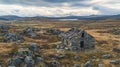 Abandoned Norwegian stone hut in a rugged Norwegian landscape.