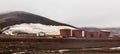 Abandoned norwegian whale hunter station rusty blubber tanks panorama at Deception island, Antarctic