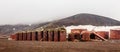 Abandoned norwegian whale hunter station rusty blubber tanks panorama at Deception island, Antarctic