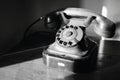Abandoned nostalgic dial telephone in black and white